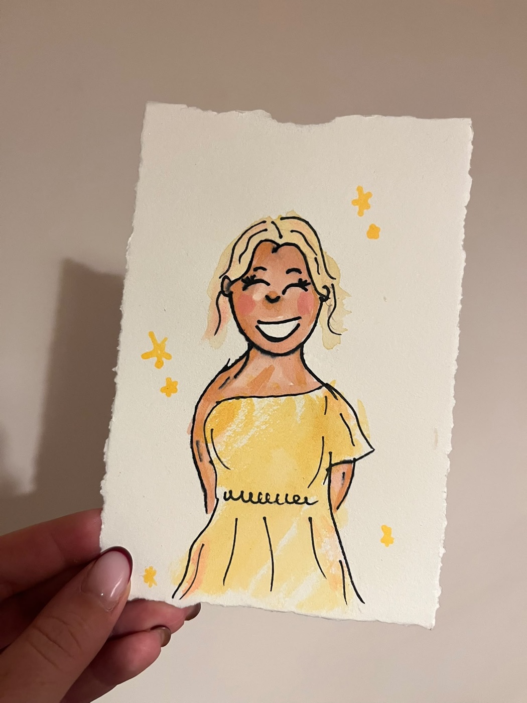 Watercolour doodle of a guest in a yellow dress, with little gold sparkles